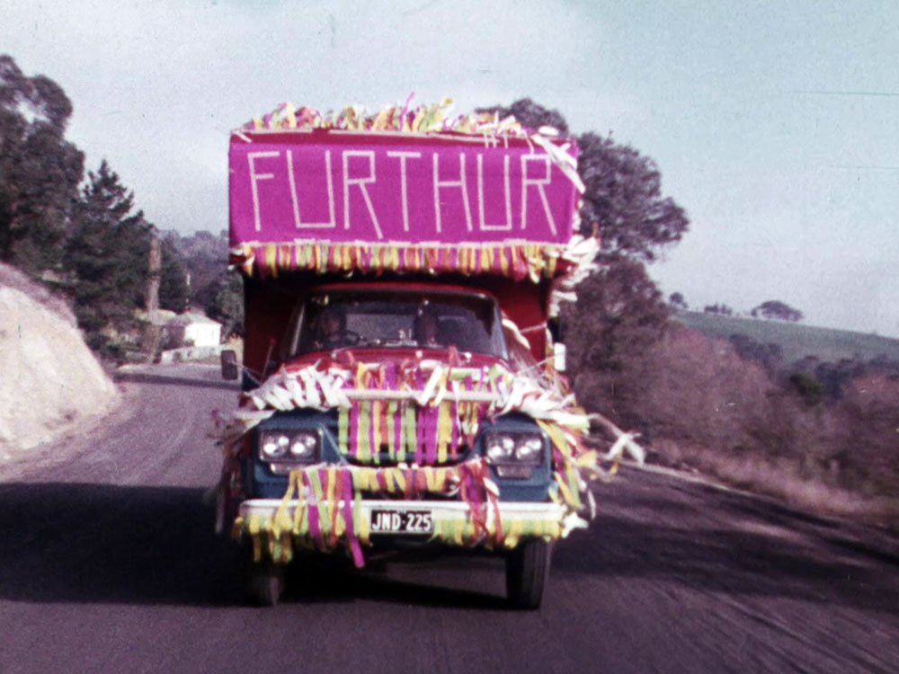 A colorful truck drives toward the camera.