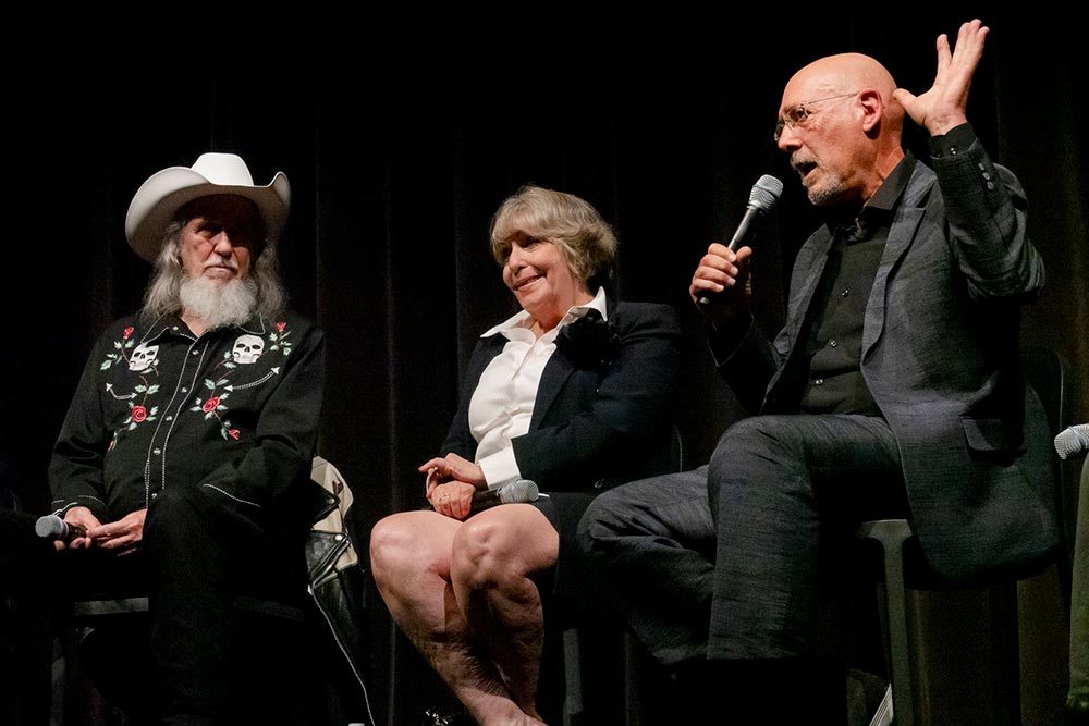 Actors Edwin Neal (the Hitchhiker) Teri McMinn (Pam) and cinematographer Daniel Pearl